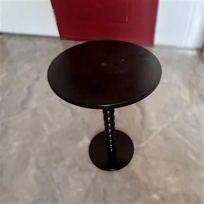 Mesa redonda negra de madera